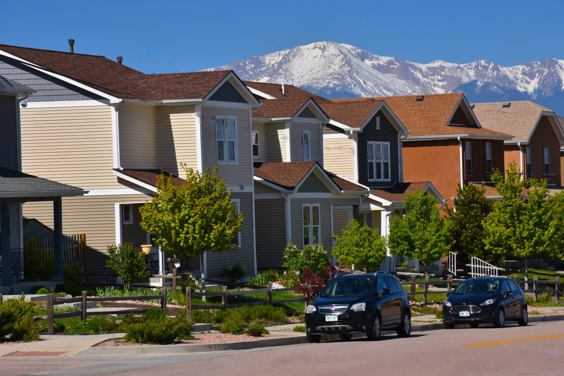 Row of houses with Pikes Peak in background