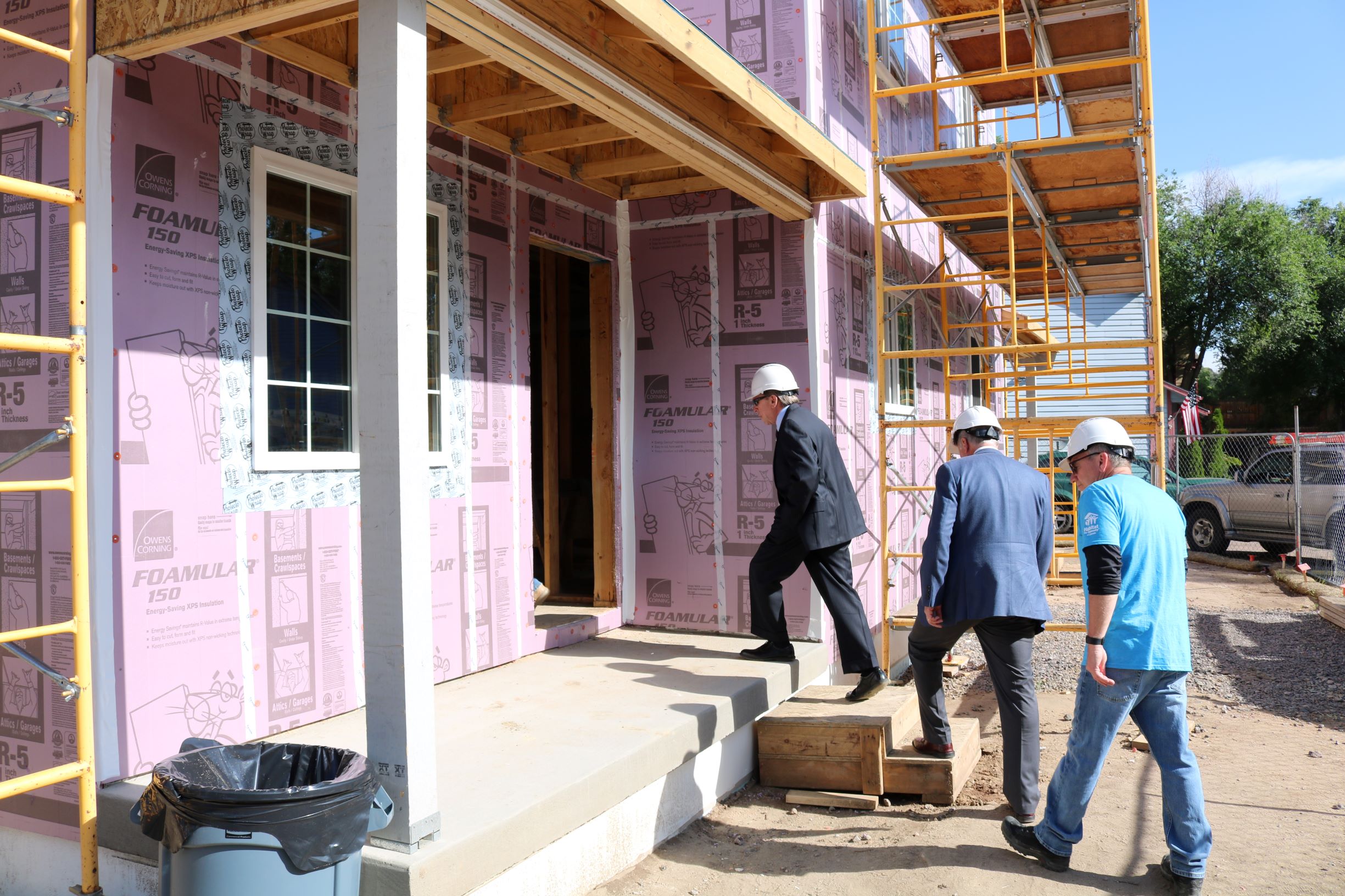 Mayor Suthers; Steve Posey, Community Development Division Manager for the City of COS; and Greg Kovach, Director of Operations at Pikes Peak Habitat, enter a current build.