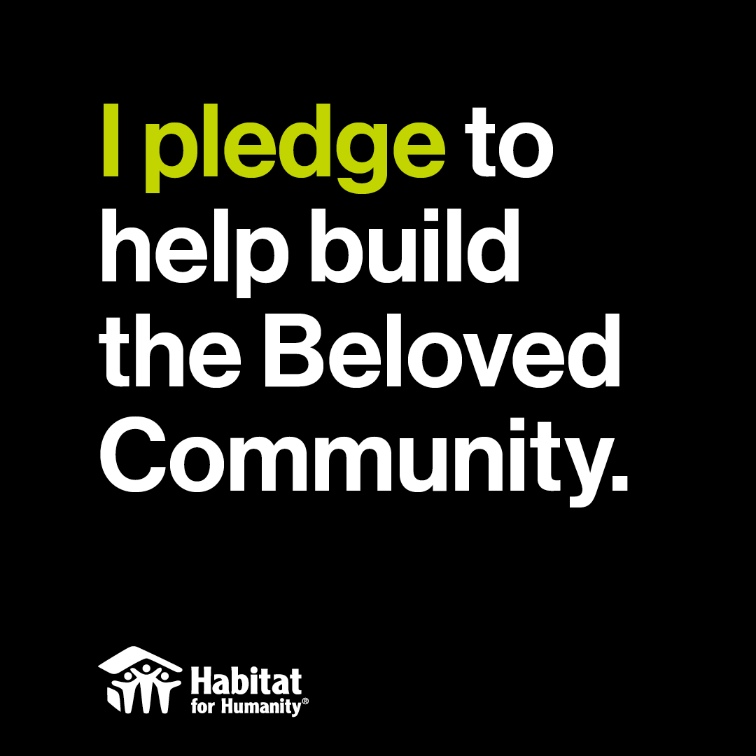 Sign that says "I pledge to help build the beloved community."