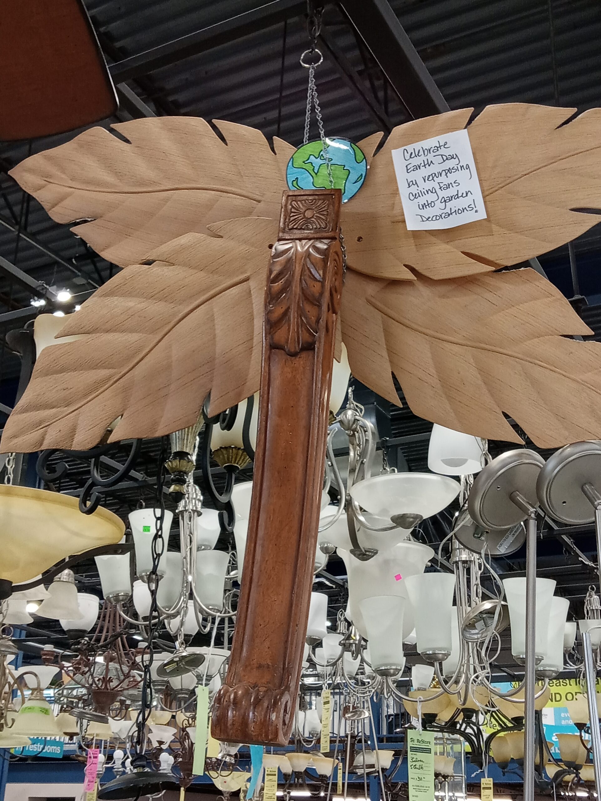 Dragonfly made from ceiling fan blades and table leg