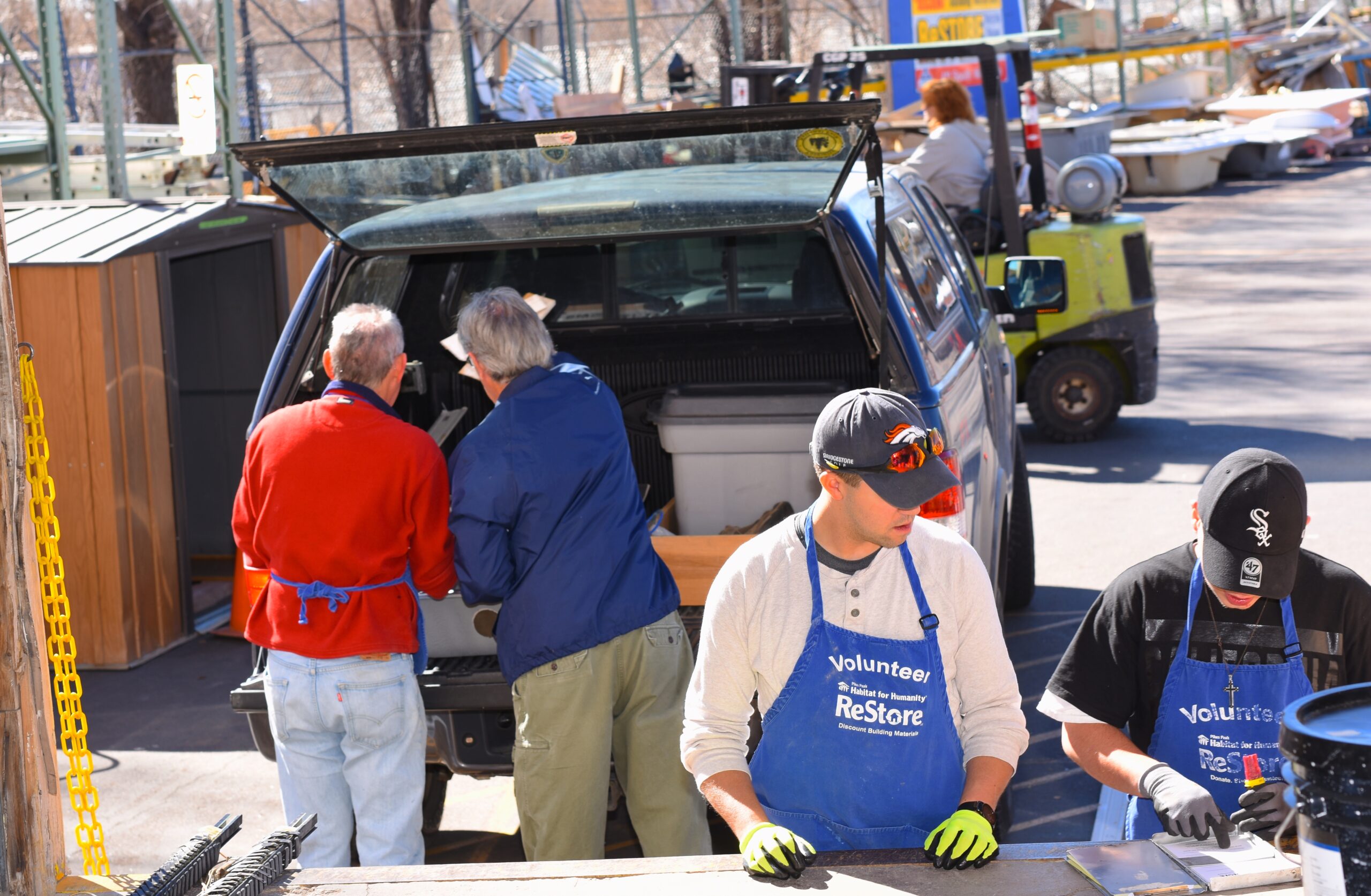 Volunteers help unload a donation