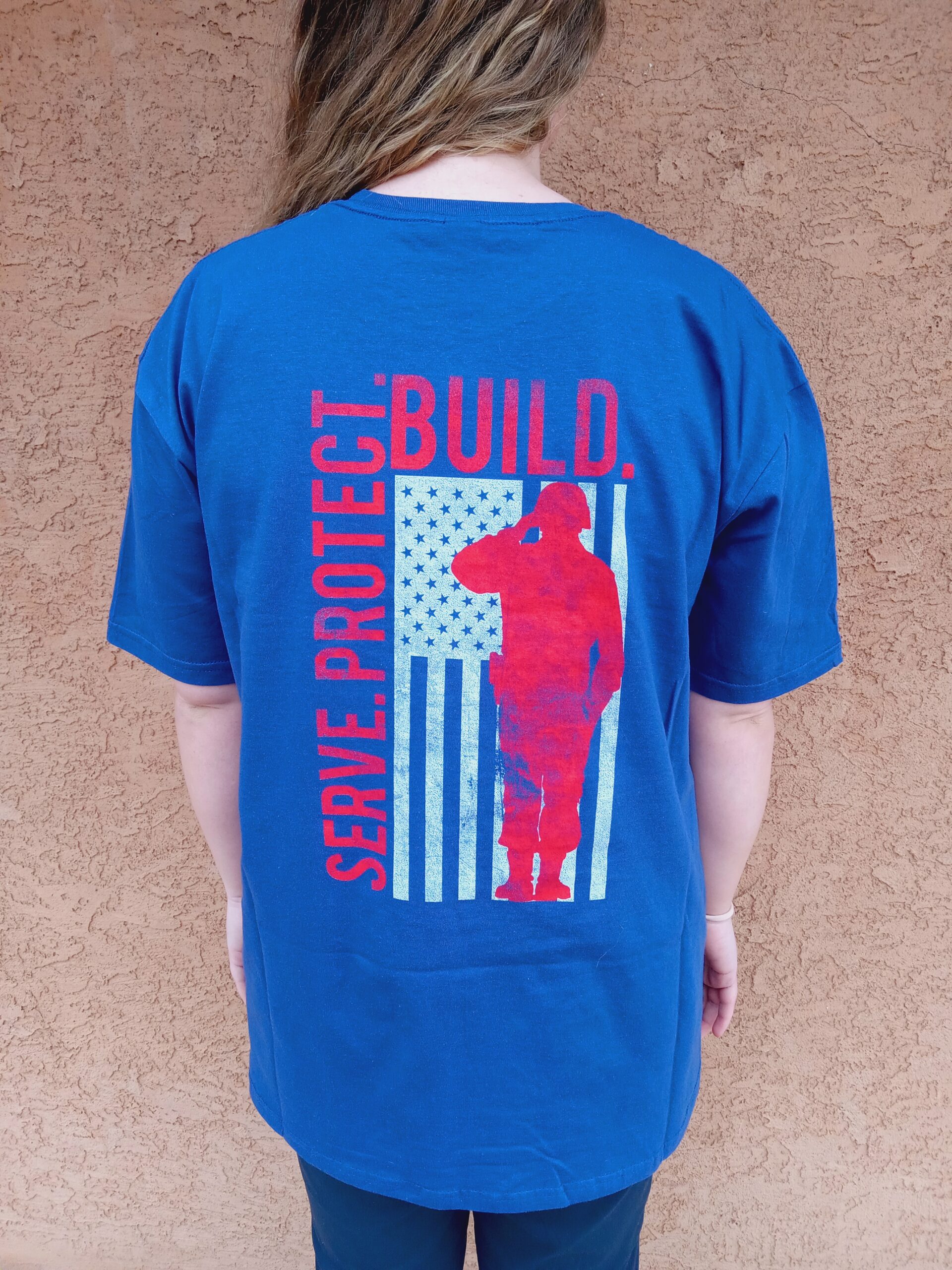 T-shirt for volunteers who are also veterans reading Serve. Protect. Build.