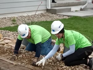 Volunteers working with gravel