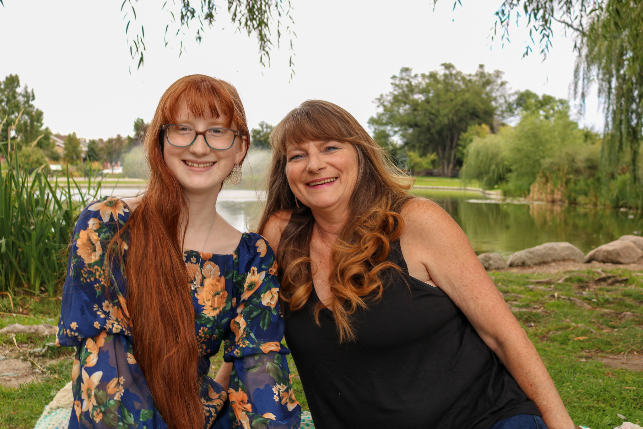 Glenda and her daughter by a lake