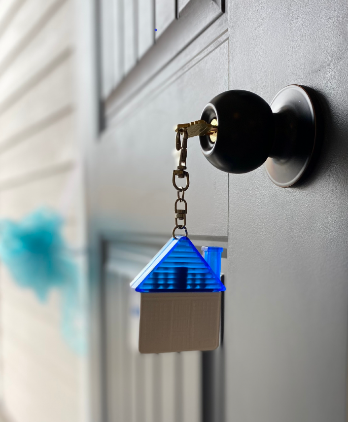 Doorknob with house-shaped keychain