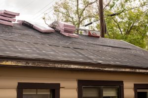 Roof with bundles of shingles ready to be installed