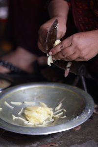 Hands preparing a meal