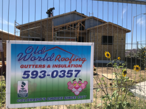 Picture of home with Old World Roofing sign