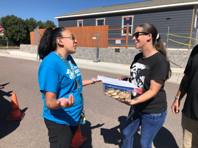 Women talking at construction site