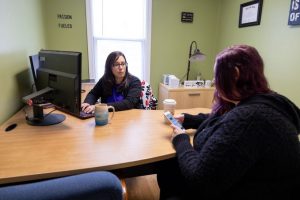 Women talking in office