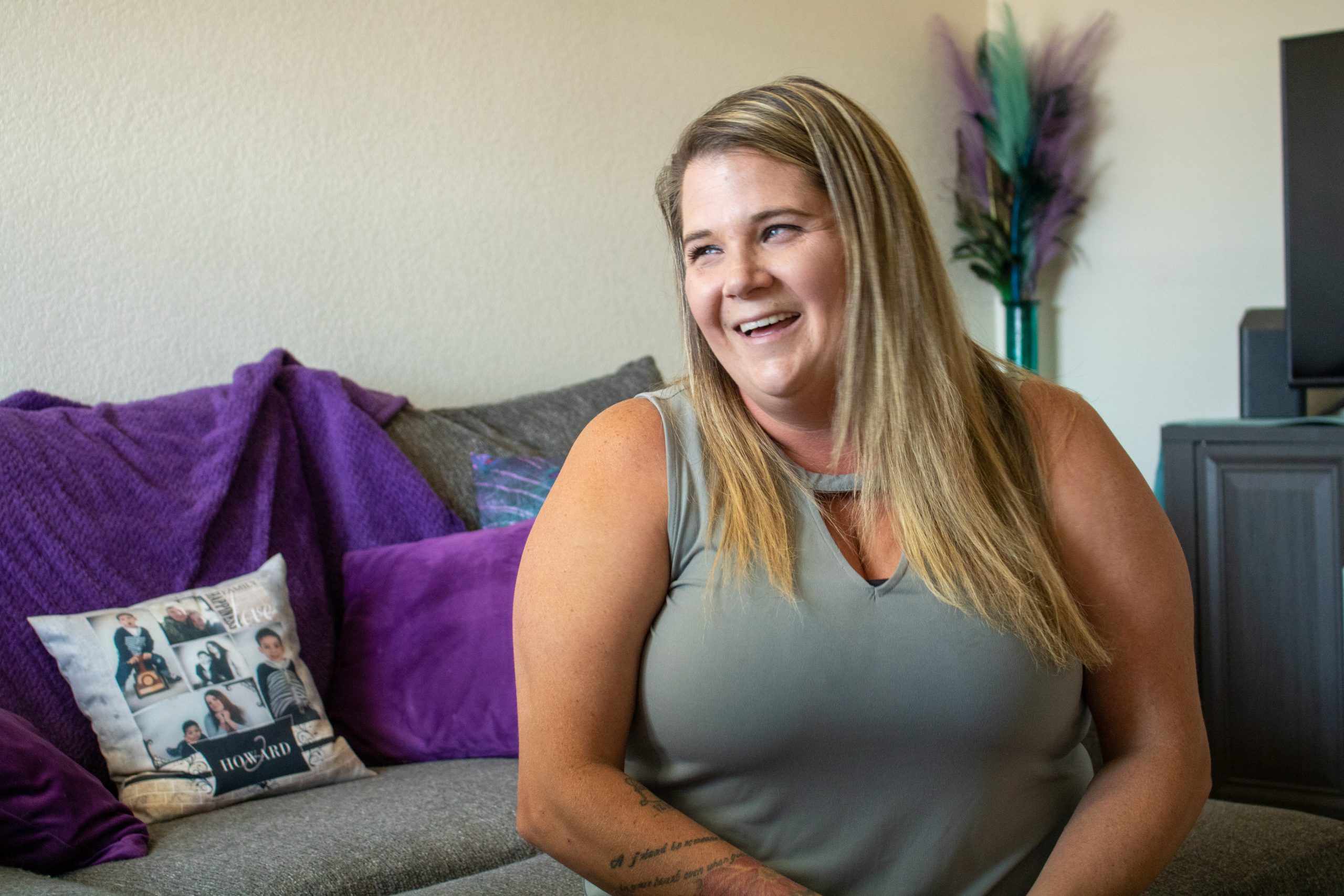 Smiling woman on sofa