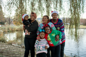 Smiling family in Christmas sweaters