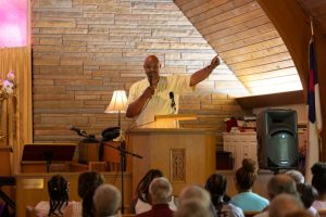 Man preaching in front of congregation