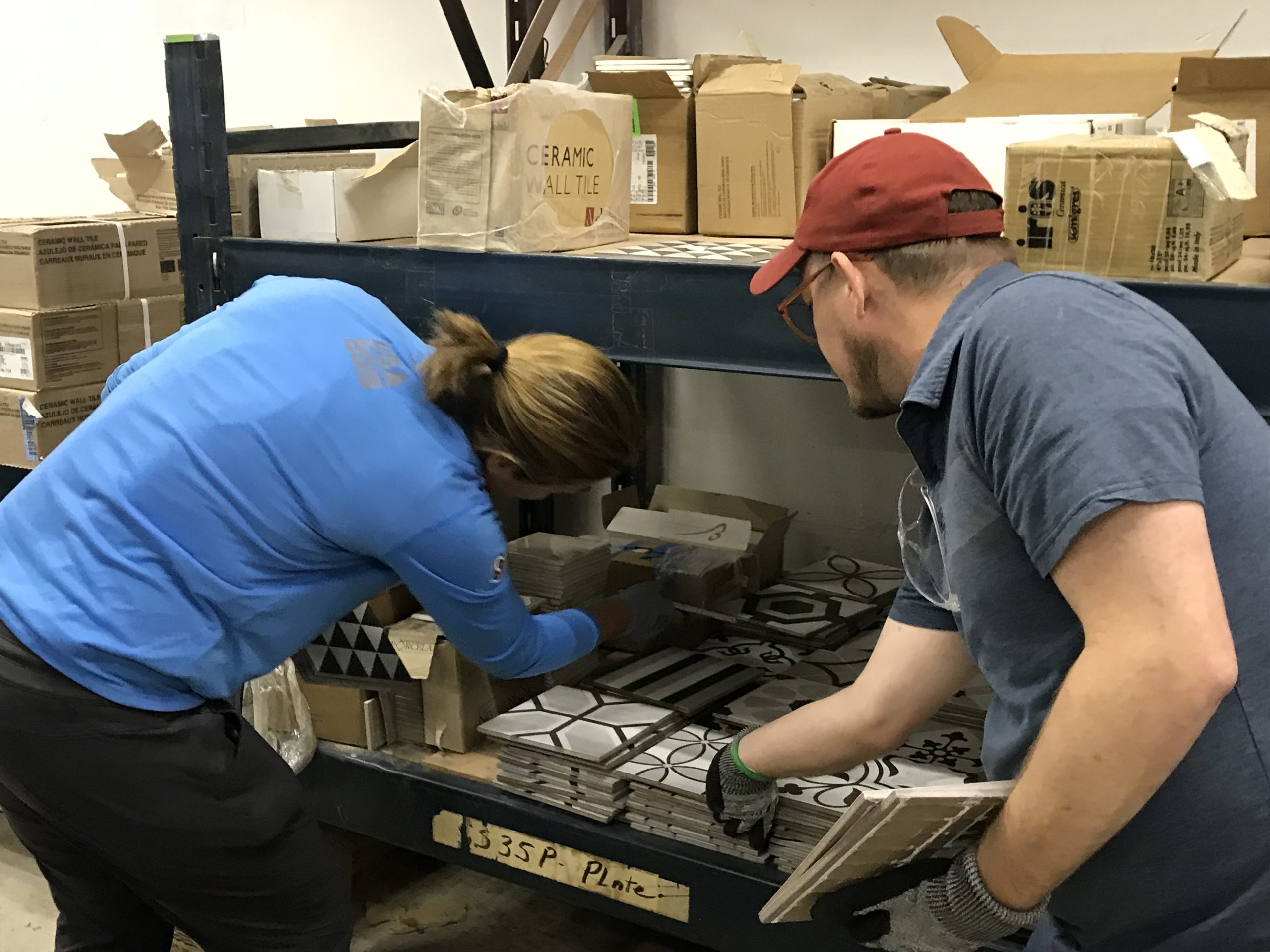 Volunteers sorting tile at ReStore South