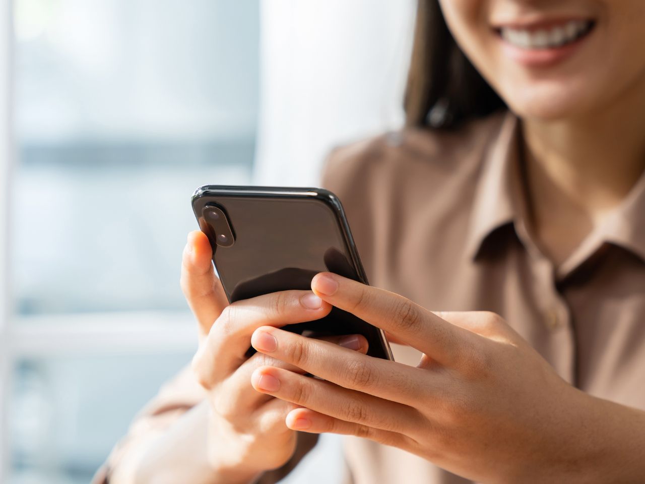 Smiling child in front of Christmas tree