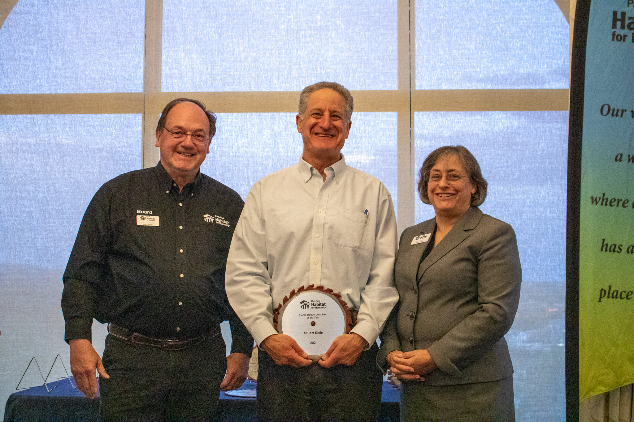 Smiling child in front of Christmas tree