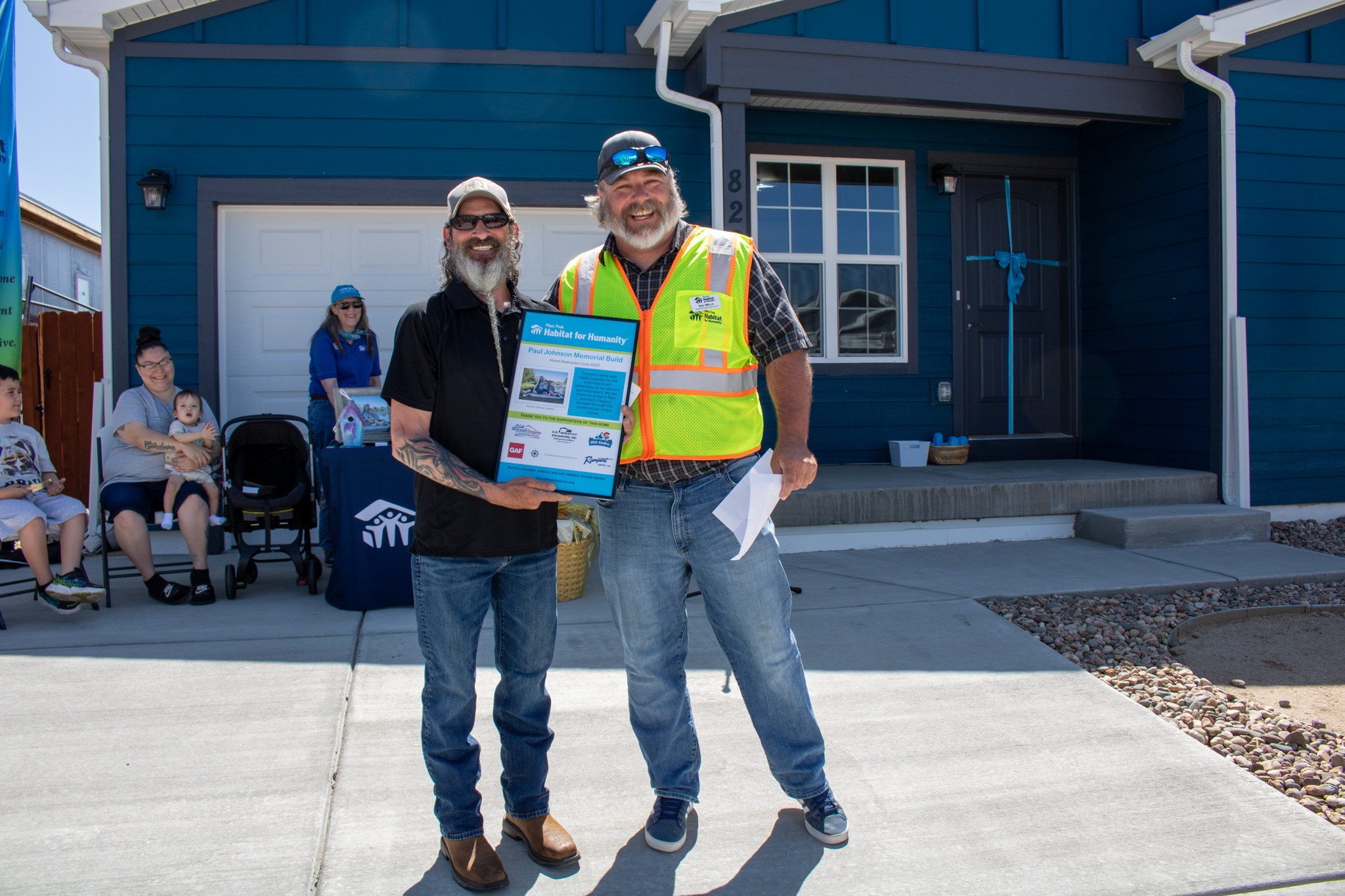 Smiling child in front of Christmas tree