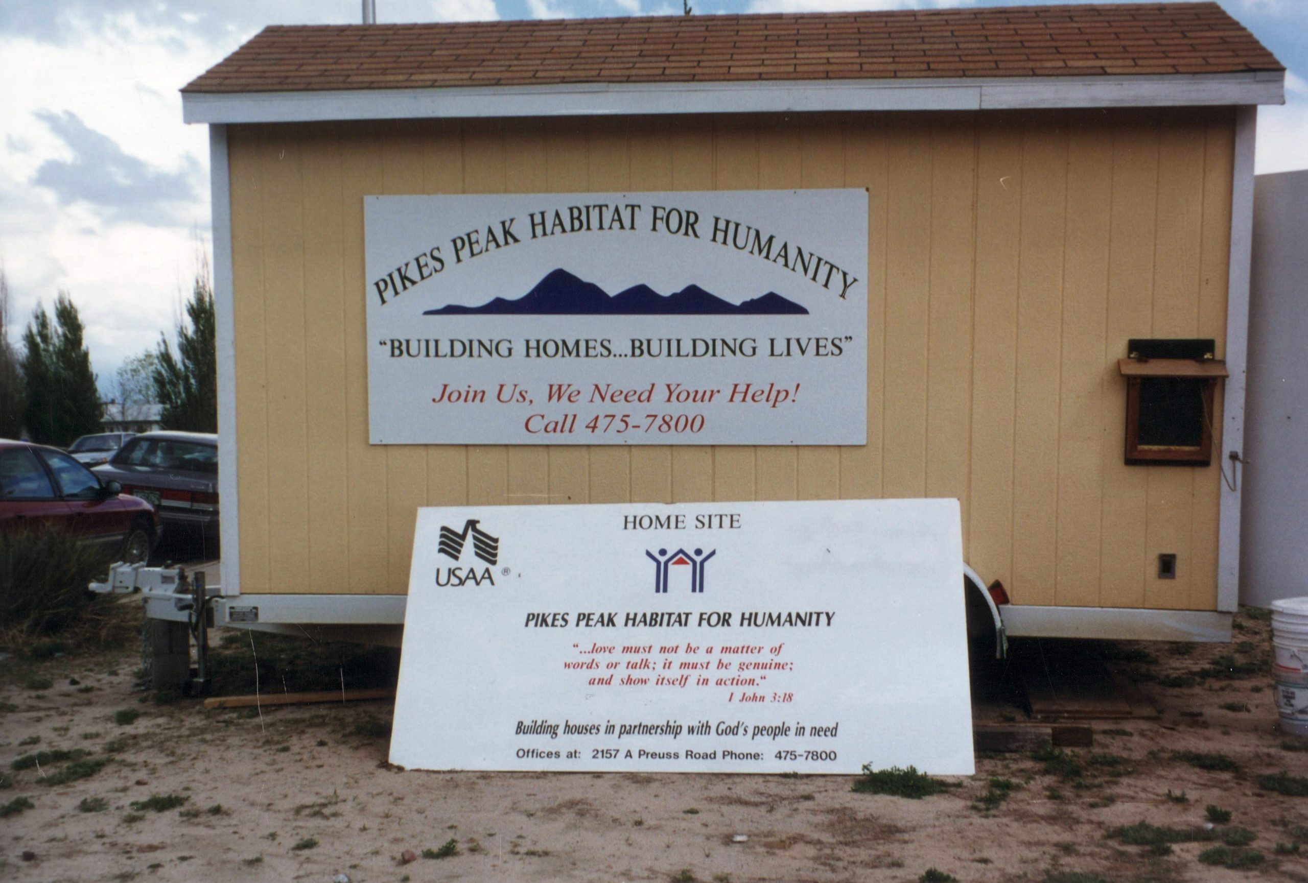 Smiling child in front of Christmas tree