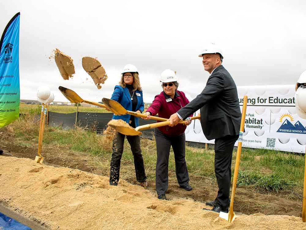 Smiling child in front of Christmas tree